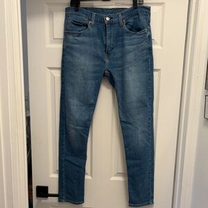 Levi's 512 slim fit taper with stretch.  Medium wash